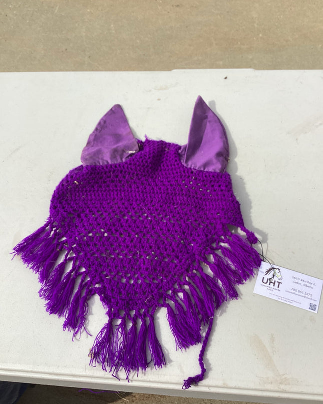 horse fly bonnet with decorative tassle on the bottom 