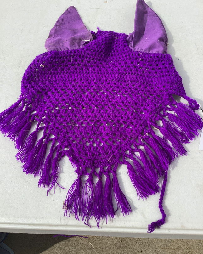 horse fly bonnet with decorative tassle on the bottom 