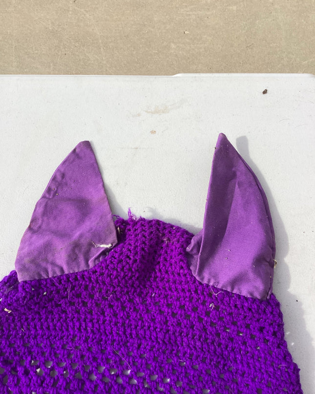 horse fly bonnet with decorative tassle on the bottom 