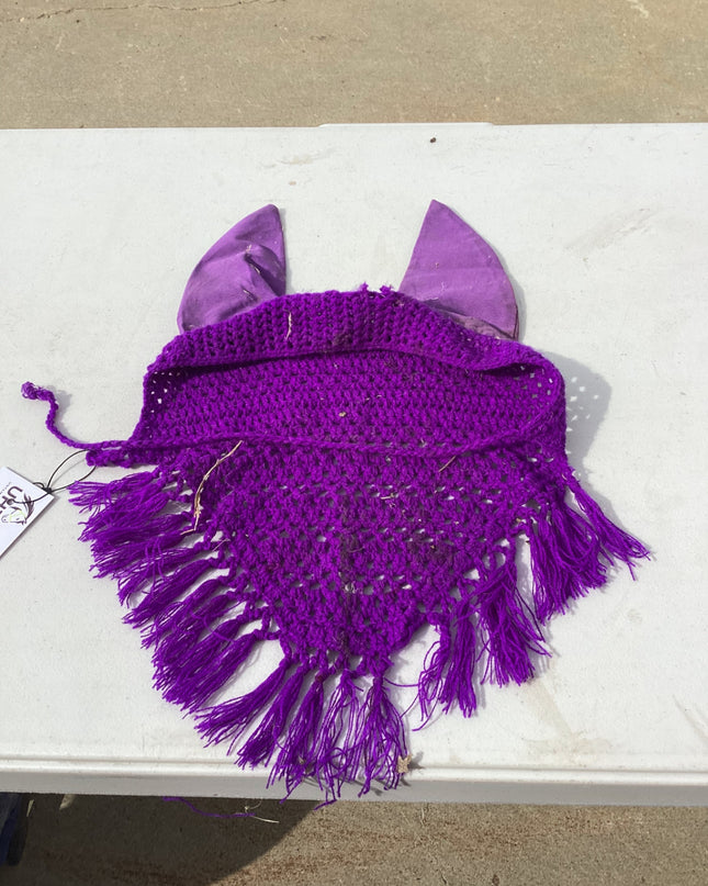 horse fly bonnet with decorative tassle on the bottom 