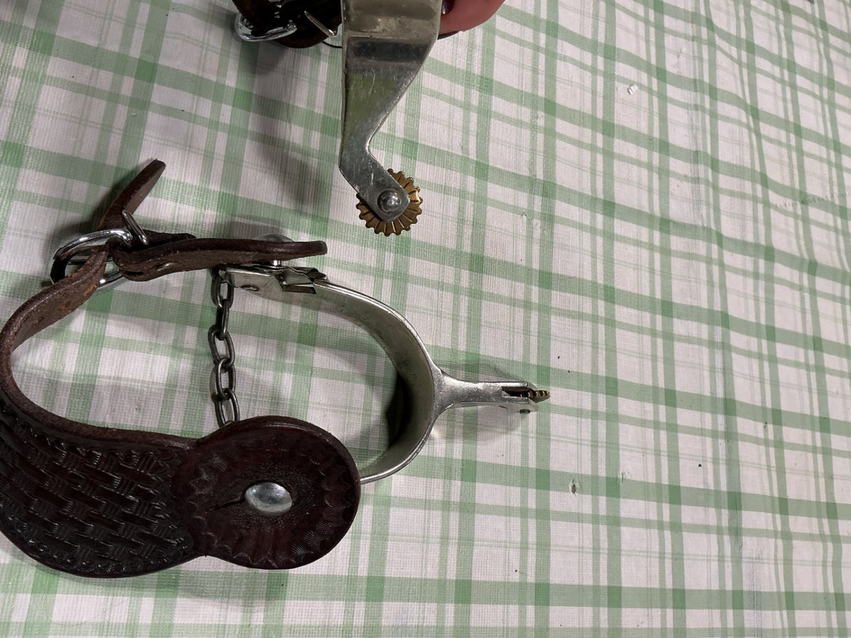 spurs with leather straps