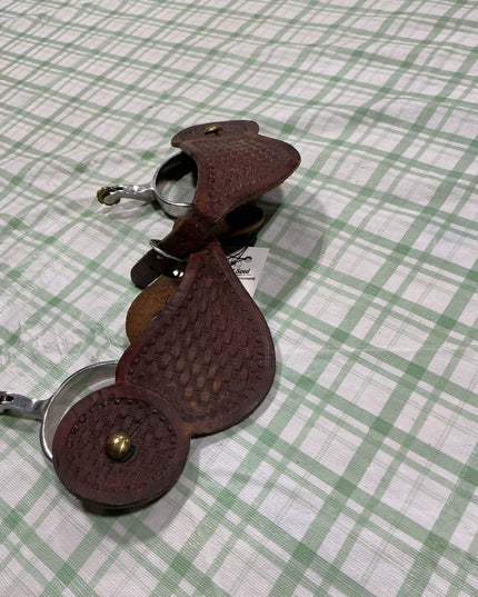 western spurs with leather straps