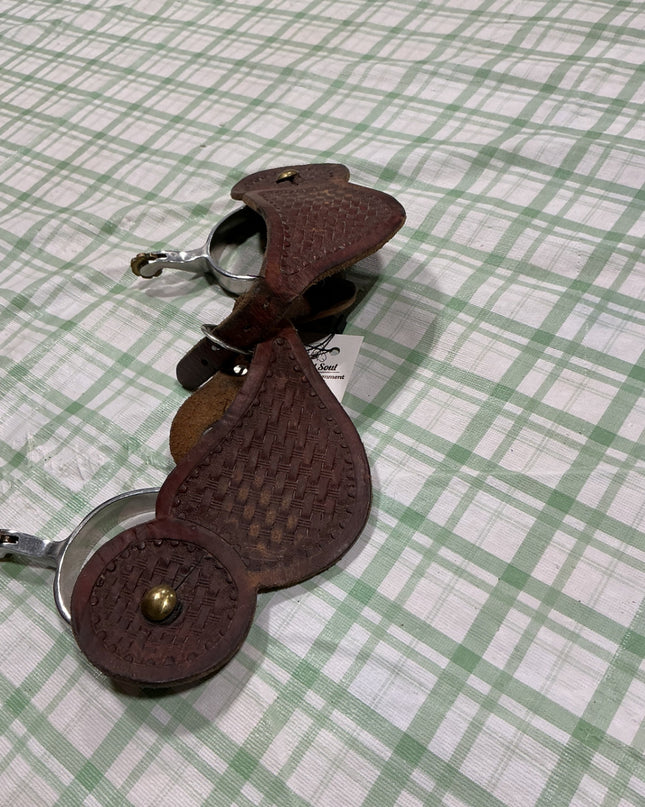 western spurs with leather straps
