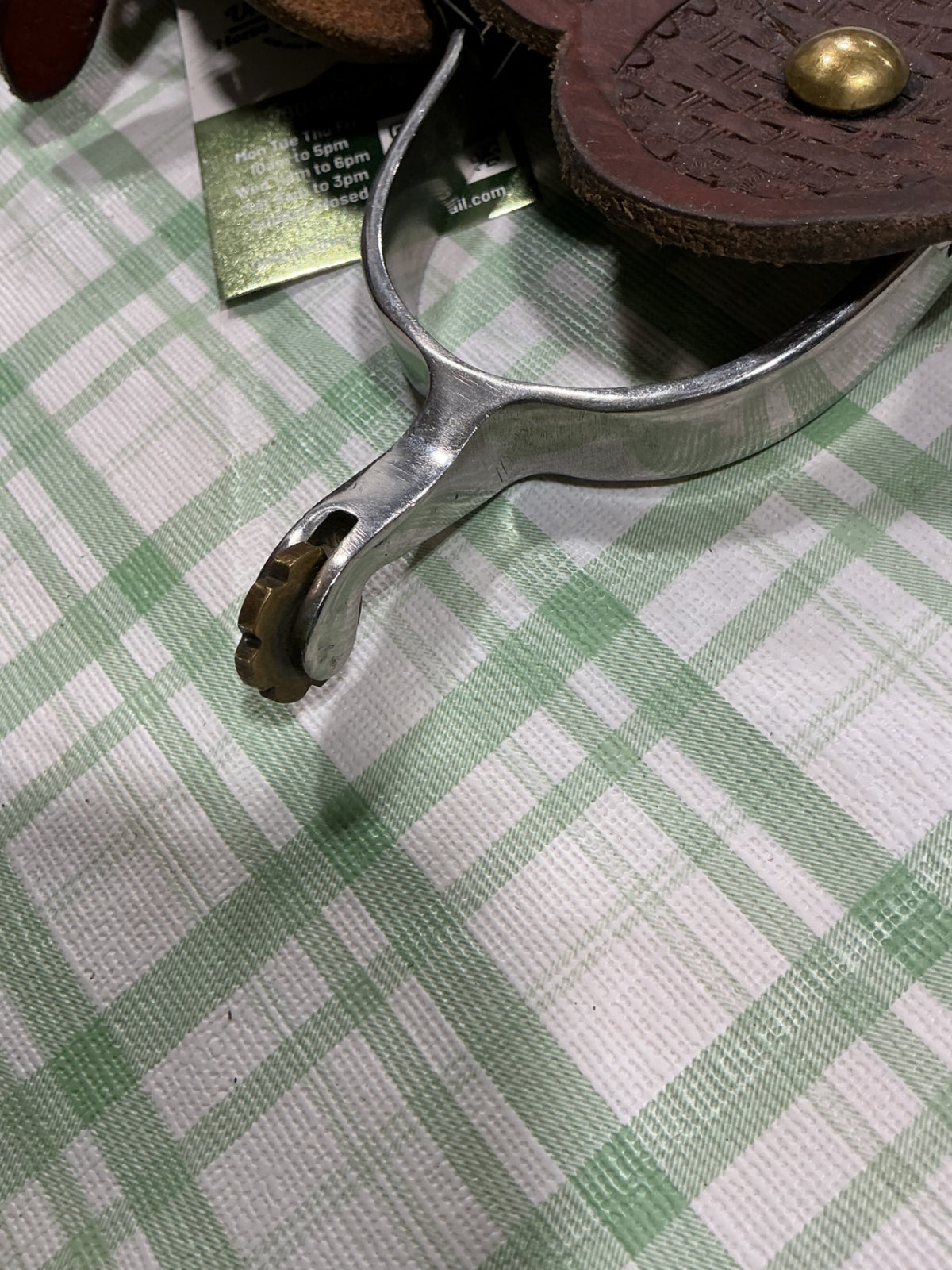 western spurs with leather straps