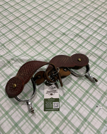 western spurs with leather straps