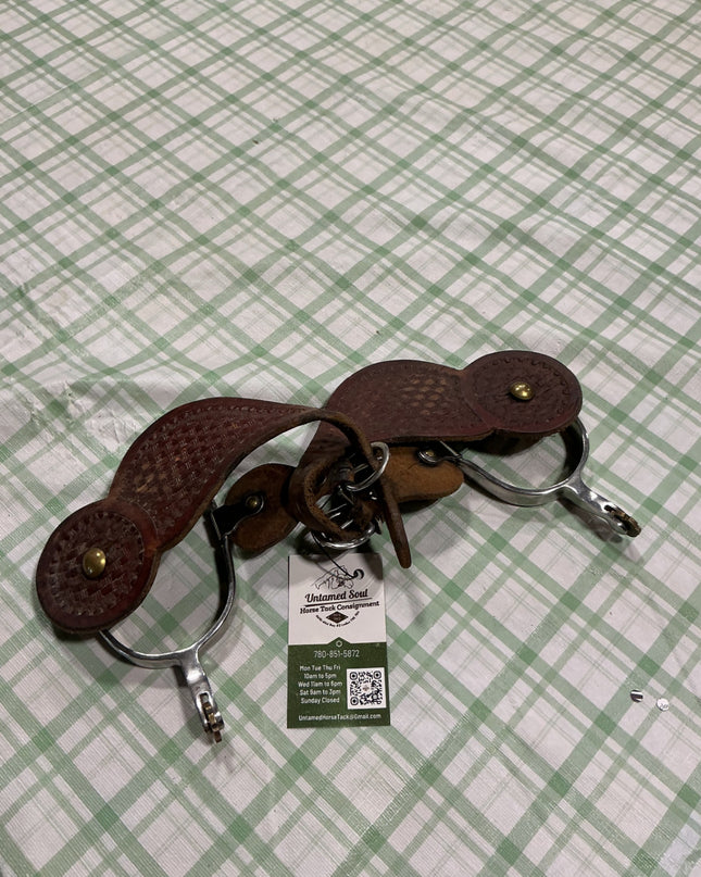 western spurs with leather straps