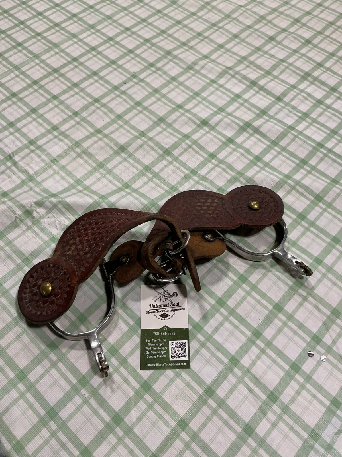 western spurs with leather straps