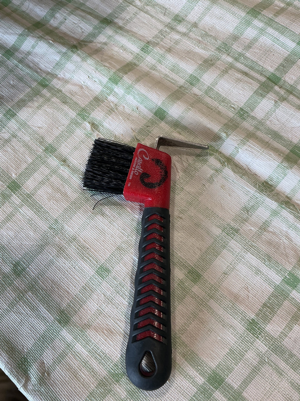 hoof pick with brush on end 