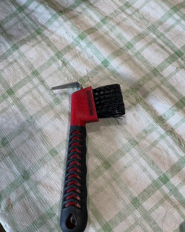 hoof pick with brush on end 