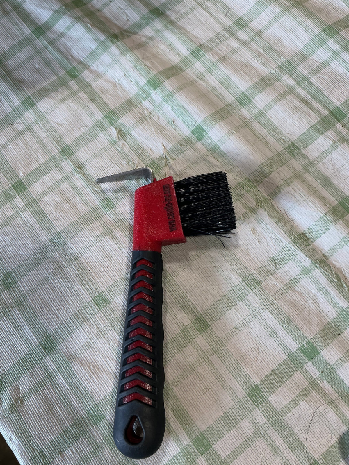hoof pick with brush on end 